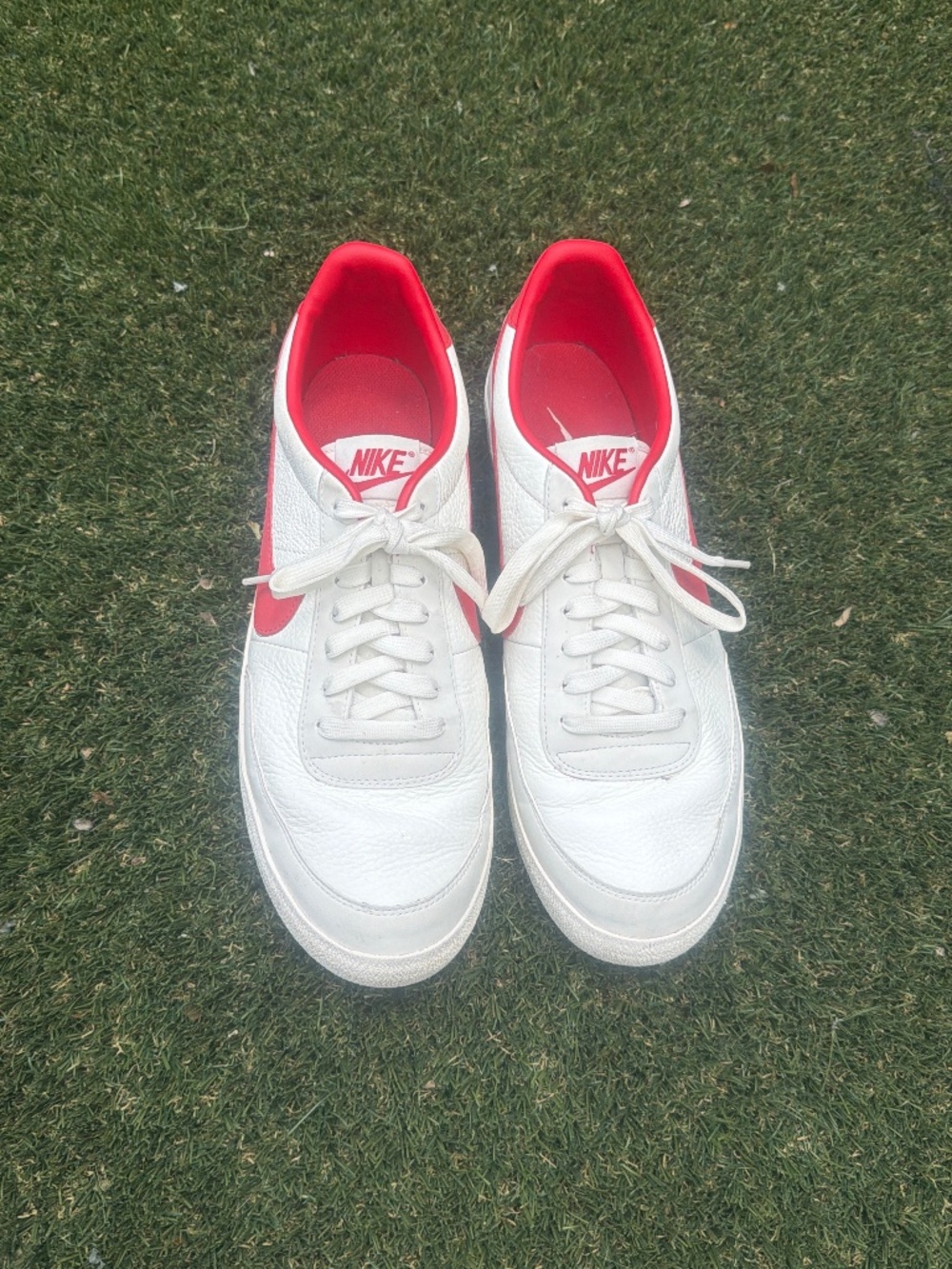 White and Red Nike shoes